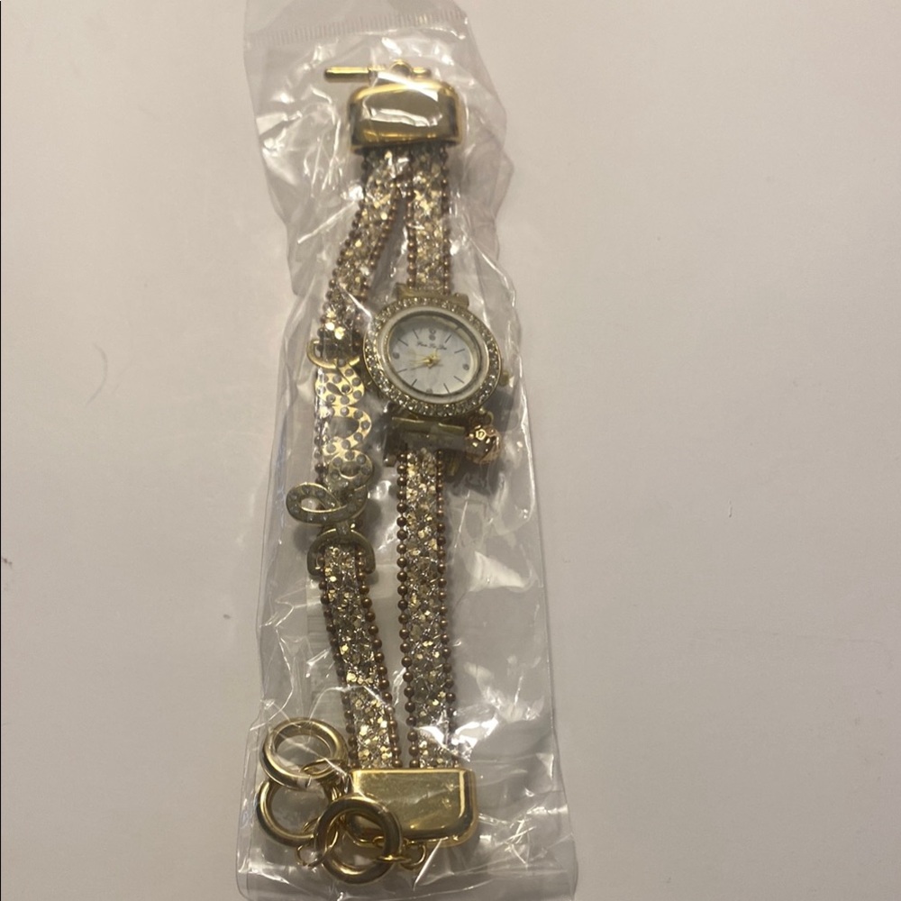 Women's Watch faux gold with attached bracelet that says LOVE